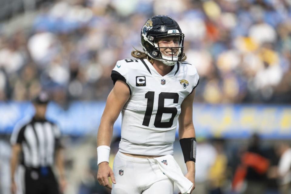 Jacksonville Jaguars quarterback Trevor Lawrence smiles after the team scores a touchdown game the Chargers.