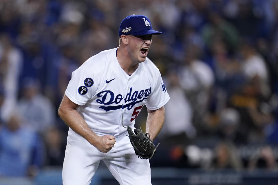 Los Angeles Dodgers relief pitcher Evan Phillips celebrates after San Diego Padres' Wil Myers hit into a double play to end the top of the sixth inning in Game 1 of a baseball NL Division Series Tuesday, Oct. 11, 2022, in Los Angeles. (AP Photo/Marcio Jose Sanchez)