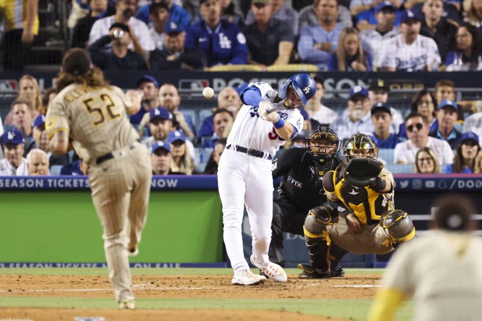 Gavin Lux hits a run-scoring double off San Diego Padres starter Mike Clevinger during the third inning Tuesday.