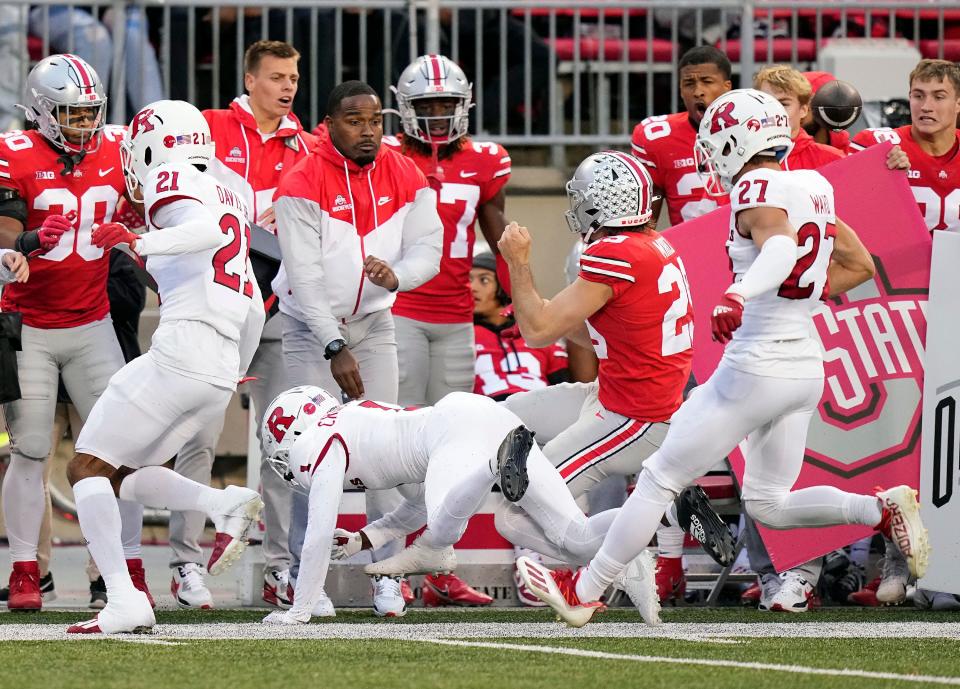 Rutgers' Aron Cruickshank hits Ohio State punter Jesse Mirco out of bounds on a fake punt. Cruickshank was kicked out of the game for the penalty.