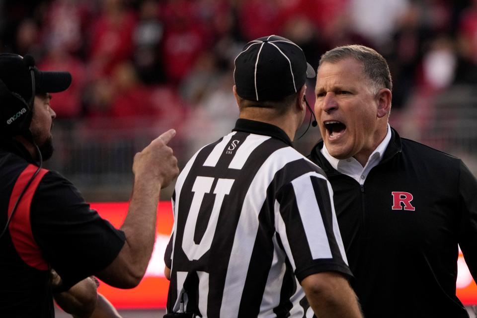Rutgers coach Greg Schiano exchanges words with Ohio State coach Ryan Day late in Saturday's game.