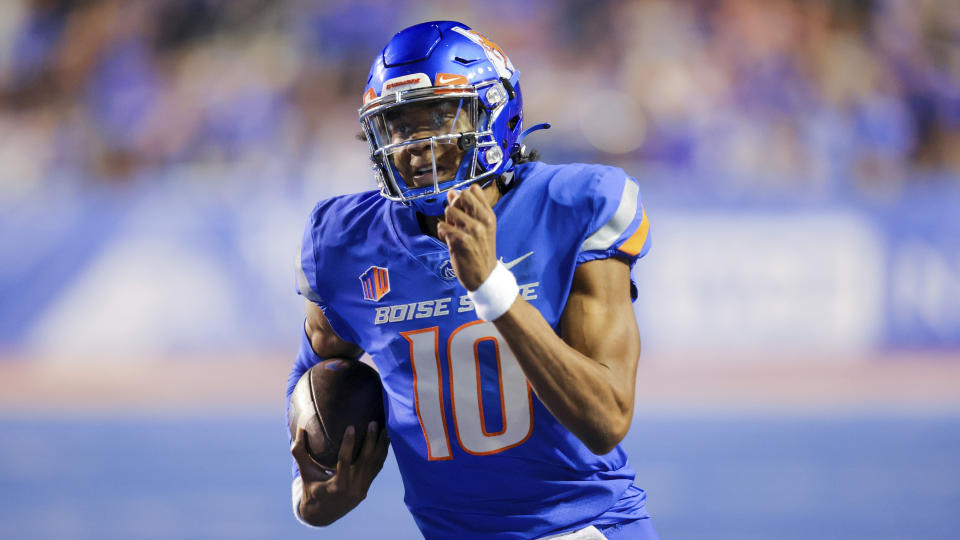 Boise State quarterback Taylen Green (10) runs down the sideline on a 39 yard touchdown scramble against San Diego State in the second half of an NCAA college football game, Friday, Sept. 30, 2022, in Boise, Idaho. Boise State won 35-13. (AP Photo/Steve Conner)
