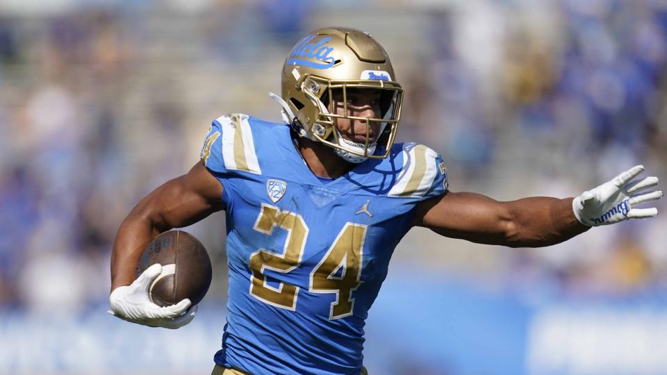 UCLA running back Zach Charbonnet (24) runs the ball during an NCAA college football game against Utah in Pasadena, Calif., Saturday, Oct. 8, 2022. (AP Photo/Ashley Landis)