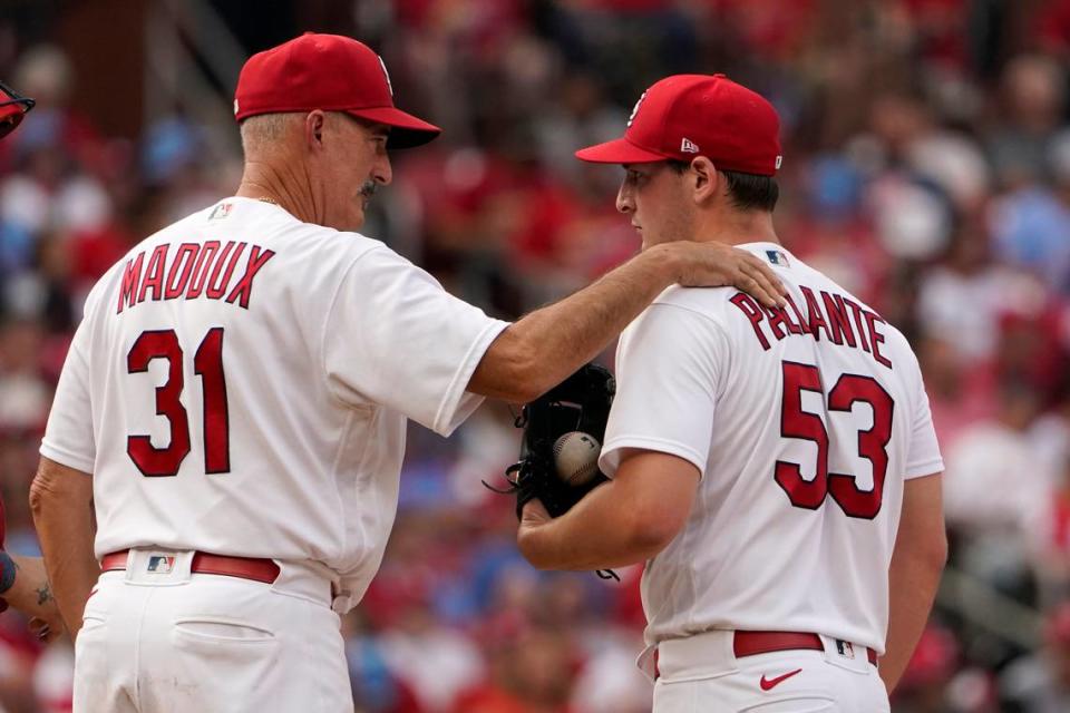 St. Louis Cardinals pitching coach Mike Maddux (31) talks with pitcher Andre Pallante (53) during a game against the Washington Nationals this season. On Wednesday, President of Baseball Operations John Mozeliak announced Maddux, hitting coach Jeff Albert, and bullpen coach Bryan Eversgerd would all be leaving the coaching staff ahead of the 2023 season.