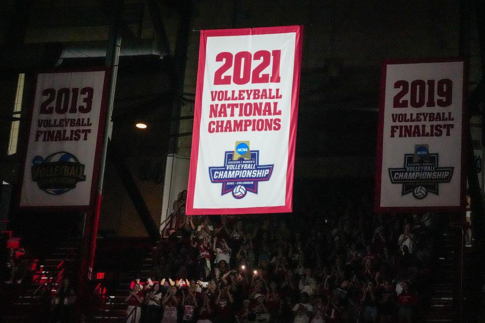 The Wisconsin Badgers unveil their 2021 NCAA volleyball championship banner at the UW Field House.