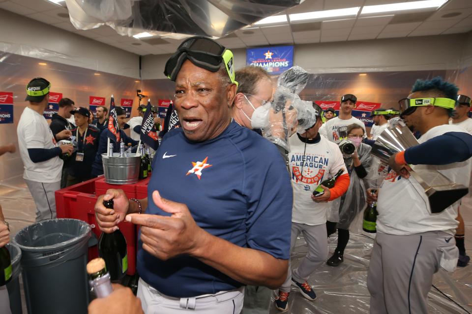 Dusty Baker celebrates in the clubhouse after the Astros swept the Yankees in the ALCS.