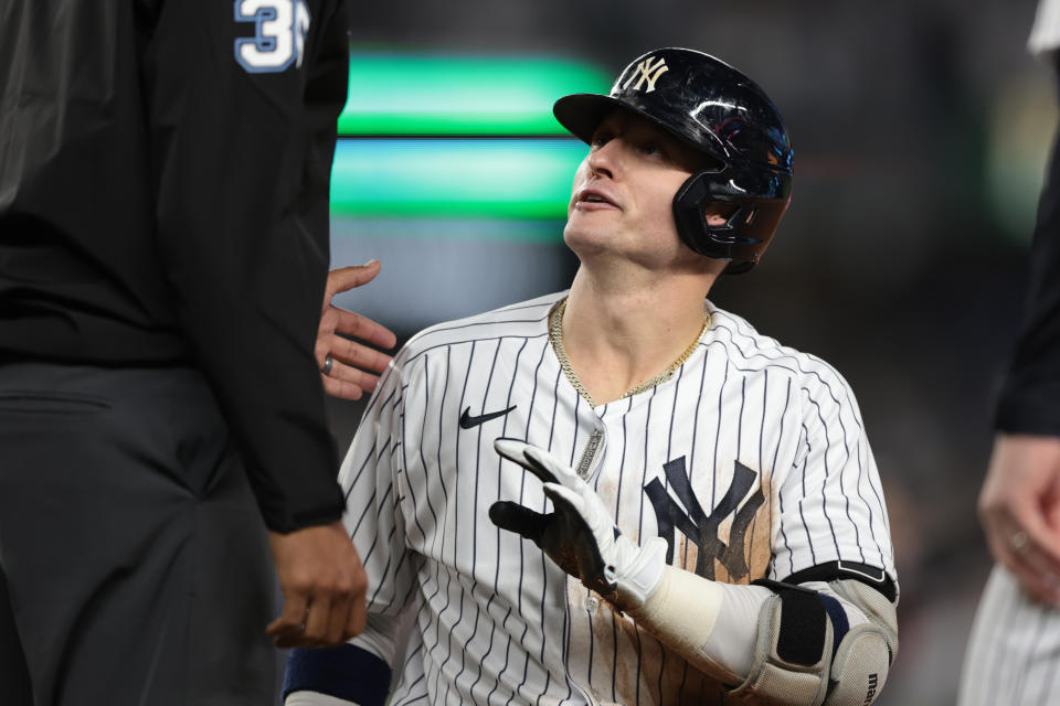 Oct 11, 2022; Bronx, New York, USA; New York Yankees third baseman Josh Donaldson (28) talks with umpire Jeremie Rehak (35) after being called out at first base during the fifth inning against the Cleveland Guardians in game one of the ALDS for the 2022 MLB Playoffs at Yankee Stadium. Mandatory Credit: Vincent Carchietta-USA TODAY Sports