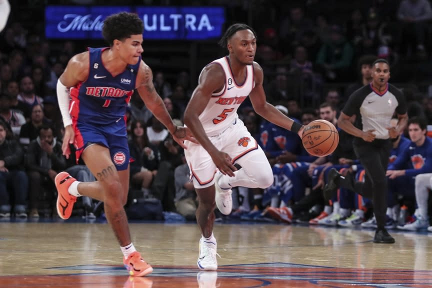 New York Knicks guard Immanuel Quickley (5) drives past Detroit Pistons guard Killian Hayes (7) in the fourth quarter at Madison Square Garden.