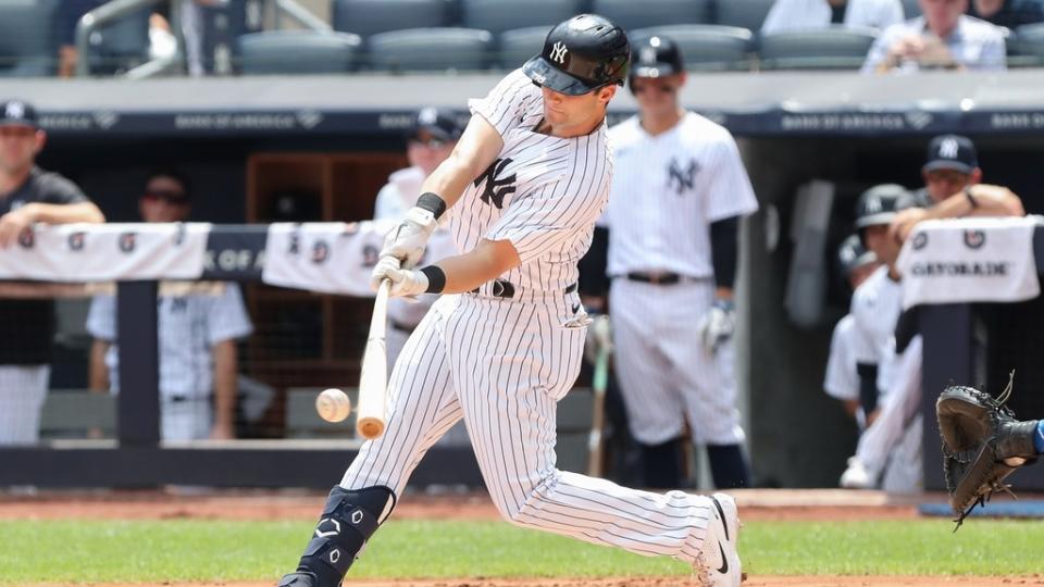 Aug 20, 2022; Bronx, New York, USA; New York Yankees left fielder Andrew Benintendi (18) hits a single against the Toronto Blue Jays during the first inning at Yankee Stadium.