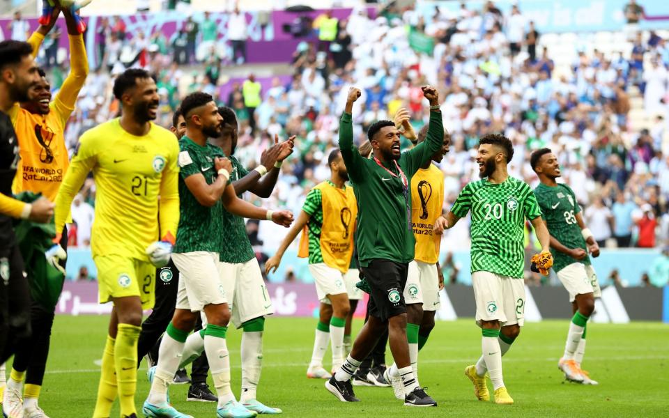 Saudi Arabia players celebrate after the match - REUTERS/Hannah Mckay