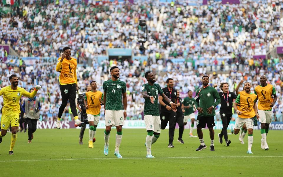 Saudi Arabia players celebrate the 2-1 win during the FIFA World Cup - GETTY IMAGES/Clive Brunskill