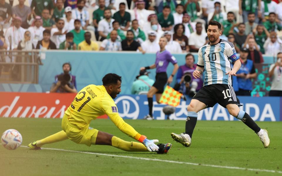 Lionel Messi (R) of Argentina scores an offside goal during the FIFA World Cup 2022 group C soccer match - SHUTTERSTOCK/Mohamed Messara