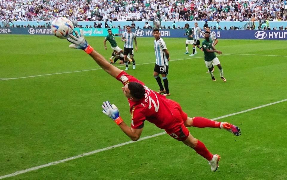 Salem Al-Dawsari of Saudi Arabia scores his team's second goal past goalkeeper Emiliano Martinez of Arg - GETTY IMAGES/Hannah McKay