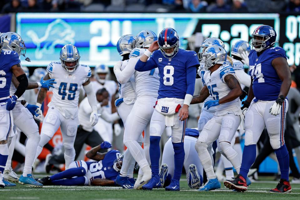 New York Giants quarterback Daniel Jones (8) reacts after throwing an interception against the Detroit Lions on Sunday, Nov. 20, 2022, in East Rutherford, N.J.