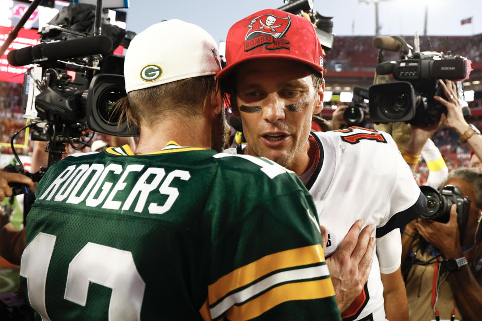 Green Bay Packers quarterback Aaron Rodgers, left, and Tampa Bay Bucs QB Tom Brady have played well below their usual standards this season. The sudden drop-off is tough to explain. (Photo by Douglas P. DeFelice/Getty Images)