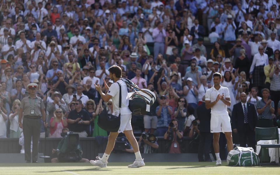 Novak Djokovic applauds - Heathcliff O'Malley for the Telegraph