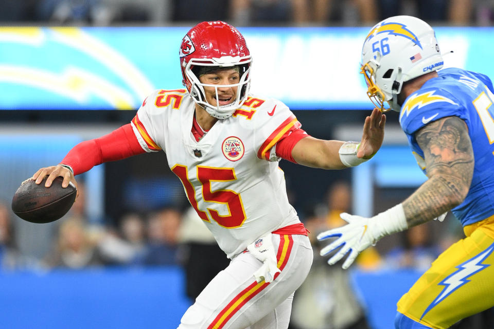 Kansas City Chiefs quarterback Patrick Mahomes (15) is rushed by Los Angeles Chargers defensive end Morgan Fox (56) during Sunday night's game. (Photo by Brian Rothmuller/Icon Sportswire via Getty Images)