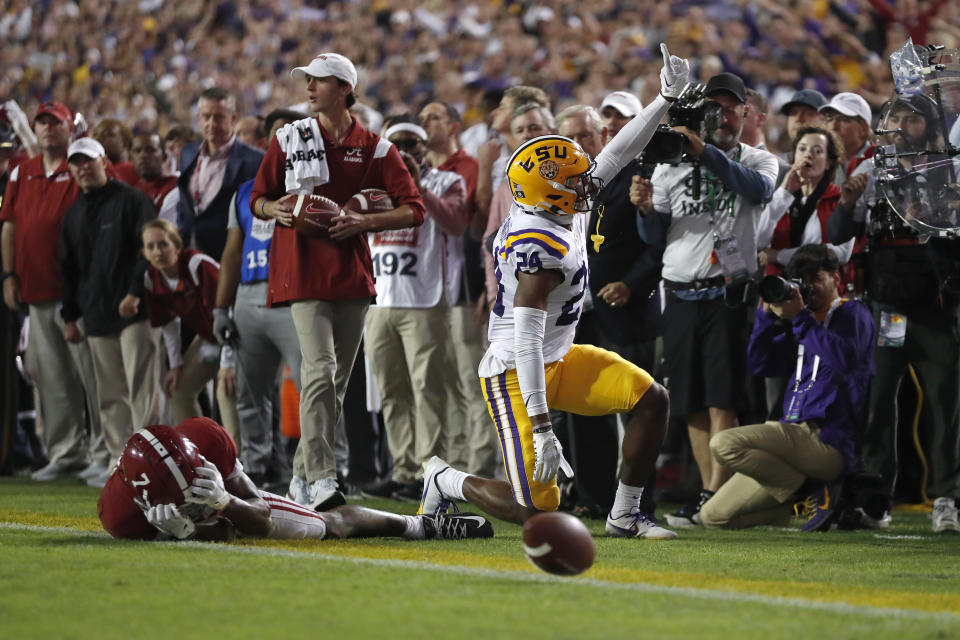 LSU cornerback Jarrick Bernard-Converse (24) reacts after a play in front of Alabama wide receiver Ja'Corey Brooks (7) during the second half of an NCAA college football game in Baton Rouge, La., Saturday, Nov. 5, 2022. LSU won 32-31 in overtime. (AP Photo/Tyler Kaufman)