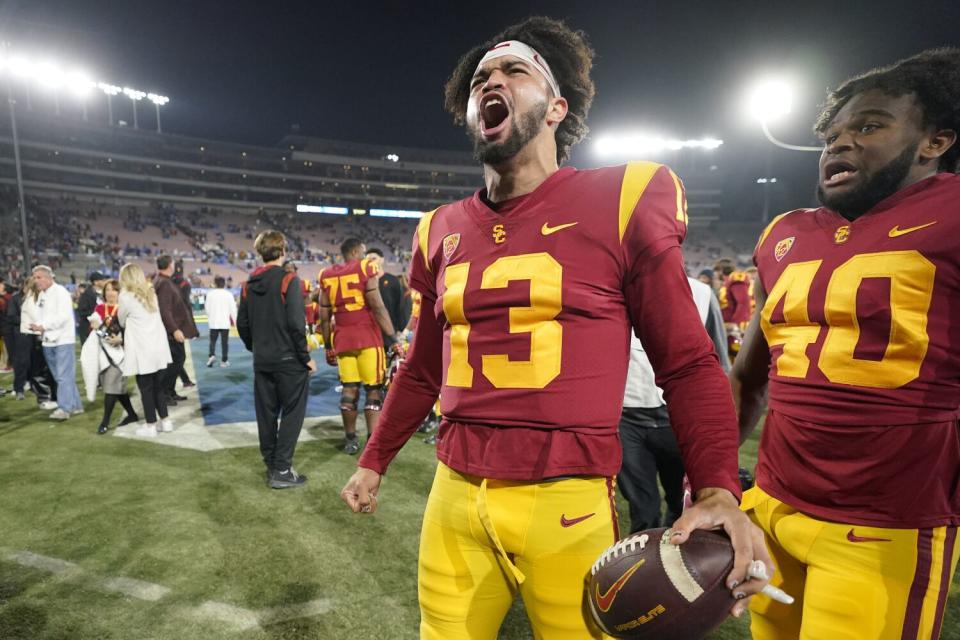 USC quarterback Caleb Williams shouts and celebrates after the Trojans defeated rival UCLA