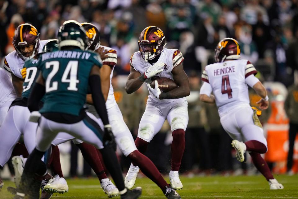 Washington Commanders running back Brian Robinson Jr. (8) runs the ball during the second half of an NFL football game against the Philadelphia Eagles, Monday, Nov. 14, 2022, in Philadelphia.