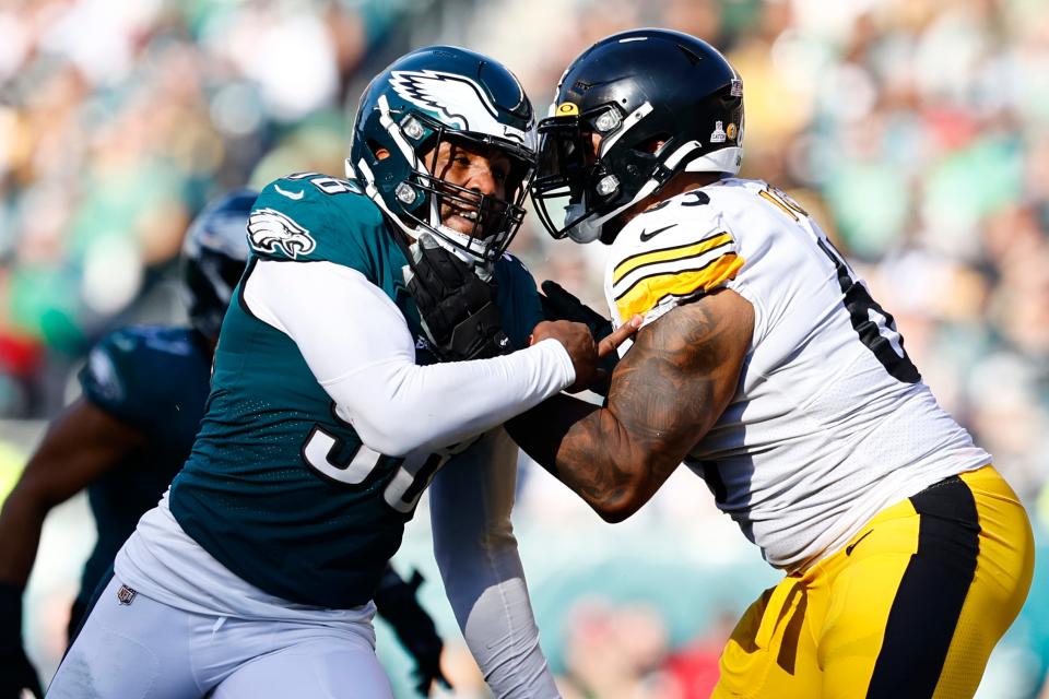 Philadelphia Eagles defensive end Robert Quinn (98) battles Pittsburgh Steelers offensive tackle Dan Moore Jr. (65) during an NFL football game, Sunday, Oct. 30, 2022, in Philadelphia.