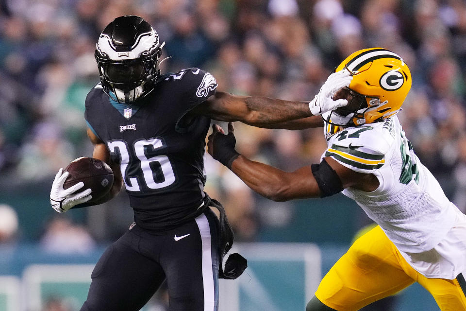 Miles Sanders of the Philadelphia Eagles stiff arms Justin Hollins of the Green Bay Packers during Sunday's win. (Photo by Mitchell Leff/Getty Images)