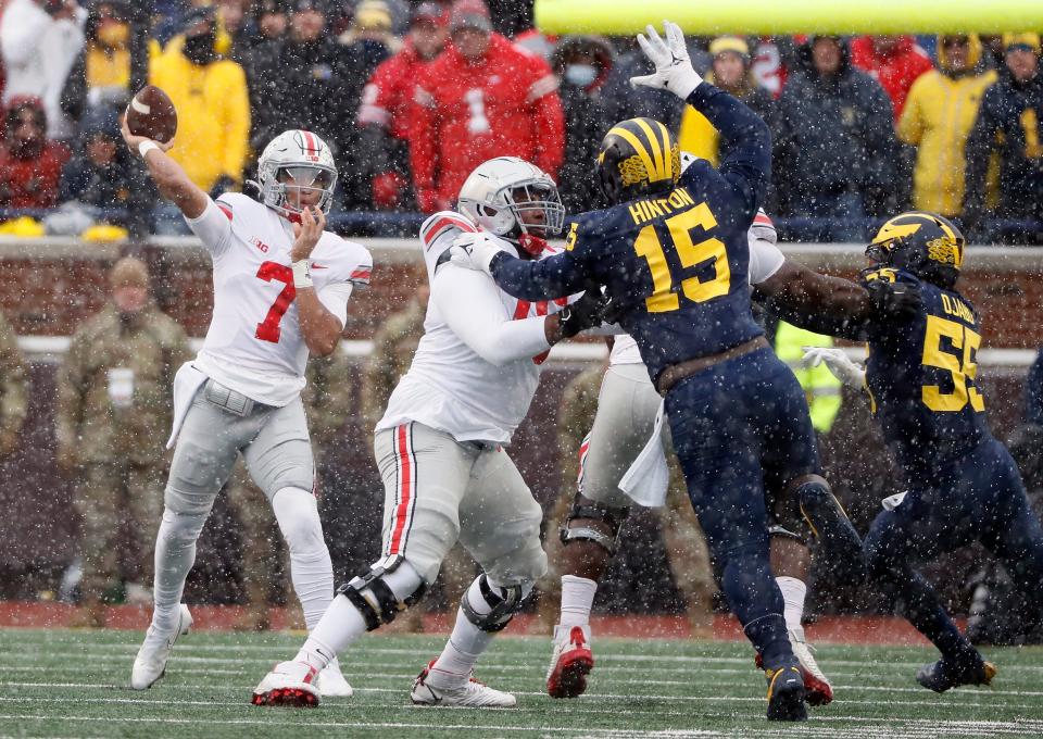 Ohio State Buckeyes quarterback C.J. Stroud (7) throws the ball against Michigan Wolverines defense during the first quarter of their NCAA College football at Michigan Stadium at Ann Arbor, Mi on November 27, 2021. 