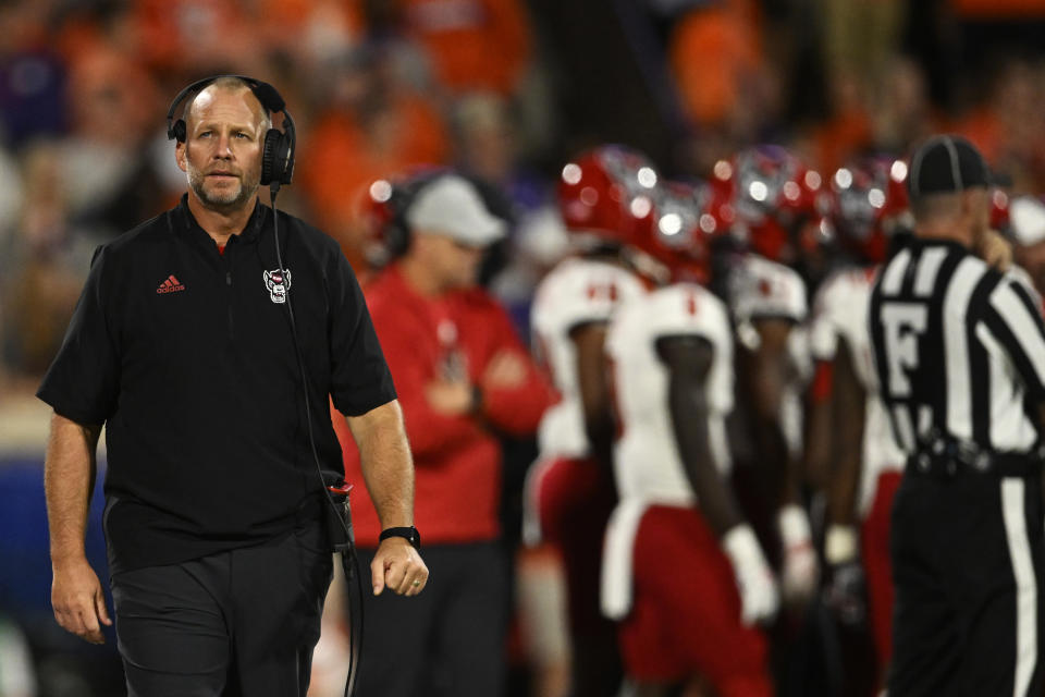 CLEMSON, SOUTH CAROLINA - OCTOBER 01: Head coach Dave Doeren of the North Carolina State Wolfpack walks on the sidelines during a timeout in the second quarter of the game against the Clemson Tigers at Memorial Stadium on October 01, 2022 in Clemson, South Carolina. (Photo by Eakin Howard/Getty Images)