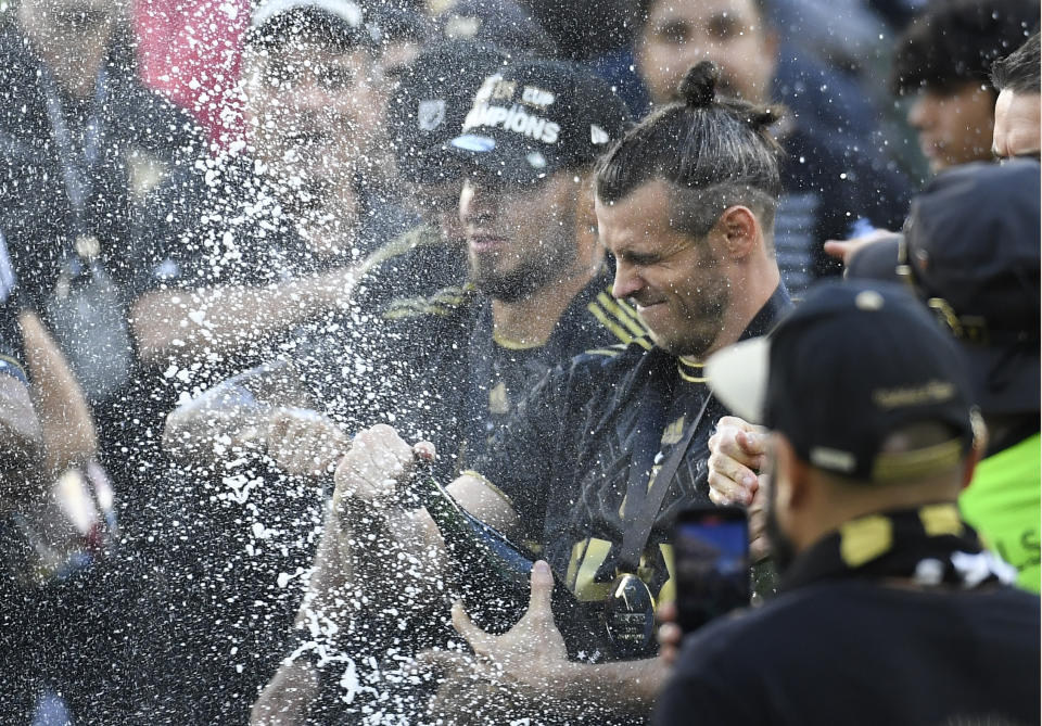 LOS ANGELES, CA - NOVEMBER 05: Gareth Bale #11 of Los Angeles FC sprays champagne after defeating Philadelphia Union in a penalty shootout during the 2022 MLS Cup Final at Banc of California Stadium on November 5, 2022 in Los Angeles, California. (Photo by Kevork Djansezian/Getty Images)