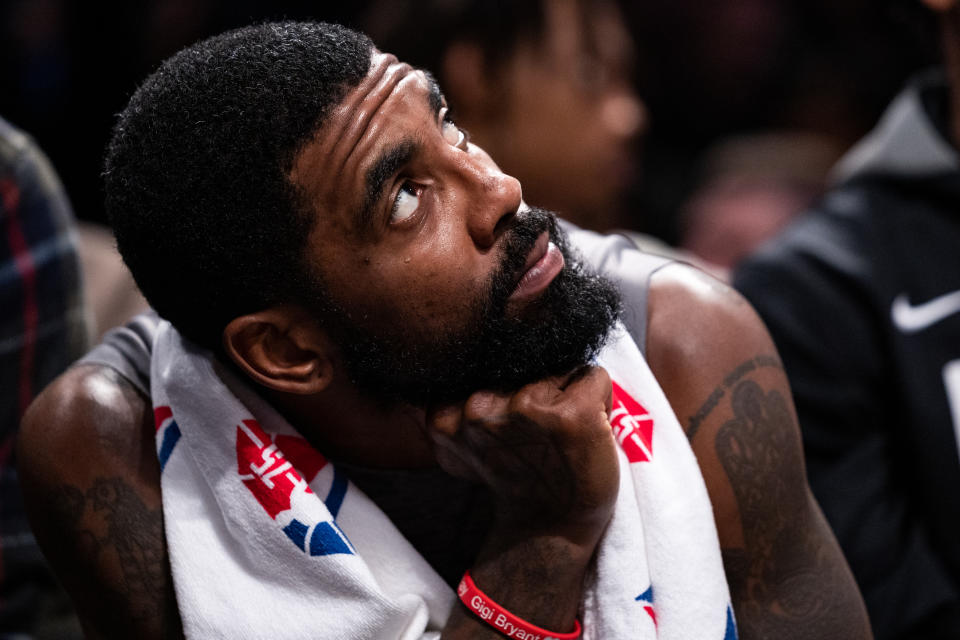 NEW YORK, NEW YORK - NOVEMBER 01: Kyrie Irving #11 of the Brooklyn Nets looks on from the bench during the second quarter of the game against the Chicago Bulls at Barclays Center on November 01, 2022 in New York City. NOTE TO USER: User expressly acknowledges and agrees that, by downloading and or using this photograph, User is consenting to the terms and conditions of the Getty Images License Agreement. (Photo by Dustin Satloff/Getty Images)