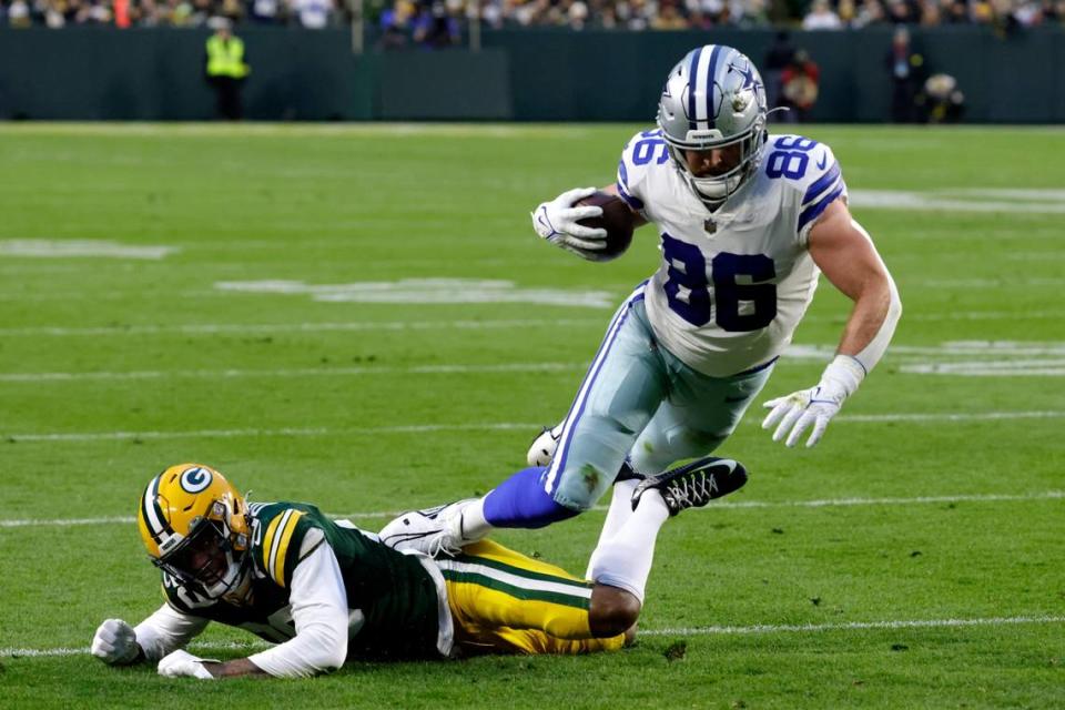 Green Bay Packers cornerback Rasul Douglas (29) stops Dallas Cowboys tight end Dalton Schultz (86) after Schultz caught a pass during the first half of an NFL football game Sunday, Nov. 13, 2022, in Green Bay, Wis. (AP Photo/Mike Roemer)