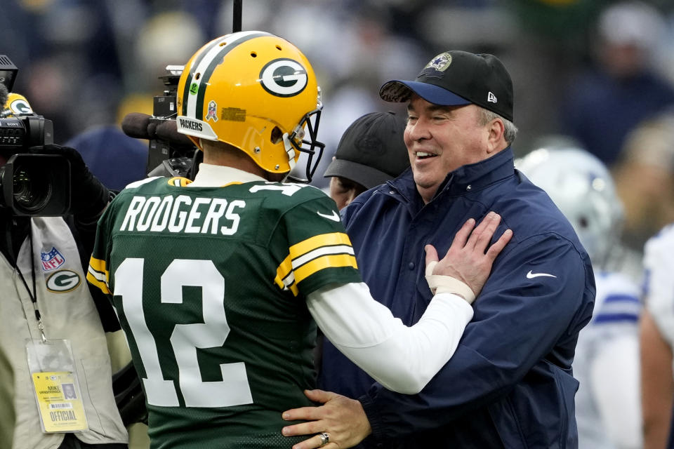 Aaron Rodgers chats with his former head coach Mike McCarthy before kickoff Sunday between the Packers and Cowboys. McCarthy wasn't in such a jovial mood postgame after Dallas lost in overtime. (Photo by Patrick McDermott/Getty Images)