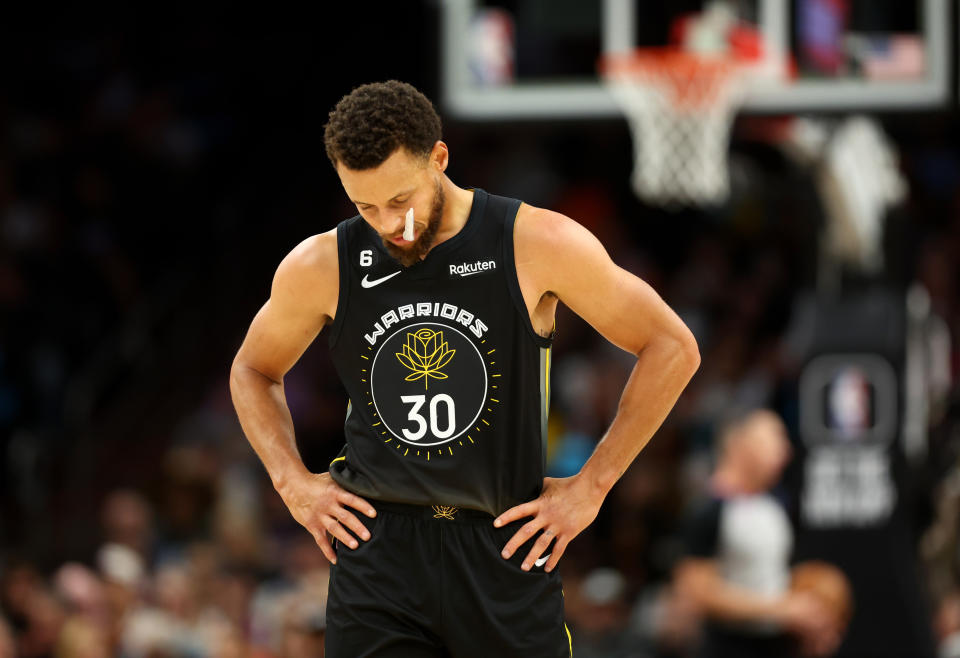 Golden State Warriors guard Stephen Curry reacts against the Phoenix Suns at Footprint Center in Phoenix on Nov. 16, 2022. (Mark J. Rebilas/USA TODAY Sports)