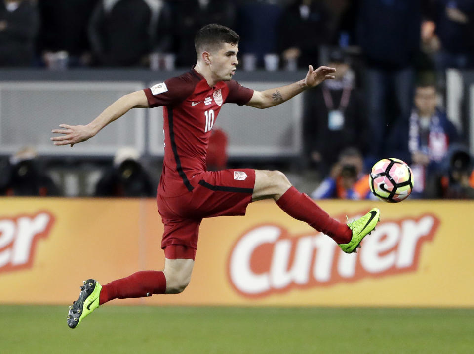 FILE - In this Friday, March 24, 2017, file photo, United States' Christian Pulisic, right, controls the ball during the first half of a World Cup qualifying soccer match against Honduras in San Jose, Calif. Pulisic is one of a number of young American players that have participated in the Generation Adidas Cup. The youth development tournament operated by Major League Soccer will hold its 10th tournament beginning this weekend outside Dallas with a record 13 international academy teams participating.(AP Photo/Marcio Jose Sanchez, File)