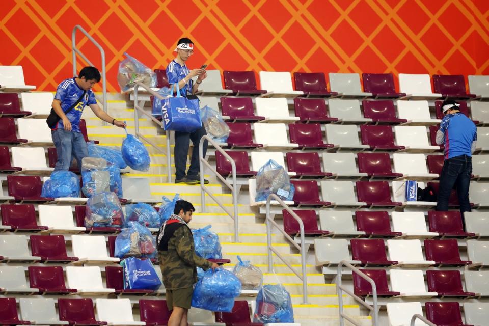Japan fans clean up at the Khalifa International Stadium (Getty Images)