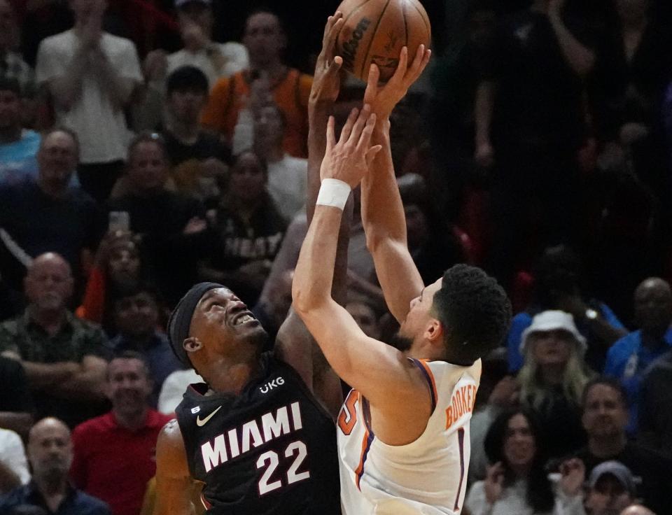 Jimmy Butler denied Devin Booker with the game on the line. (Jim Rassol/Reuters)