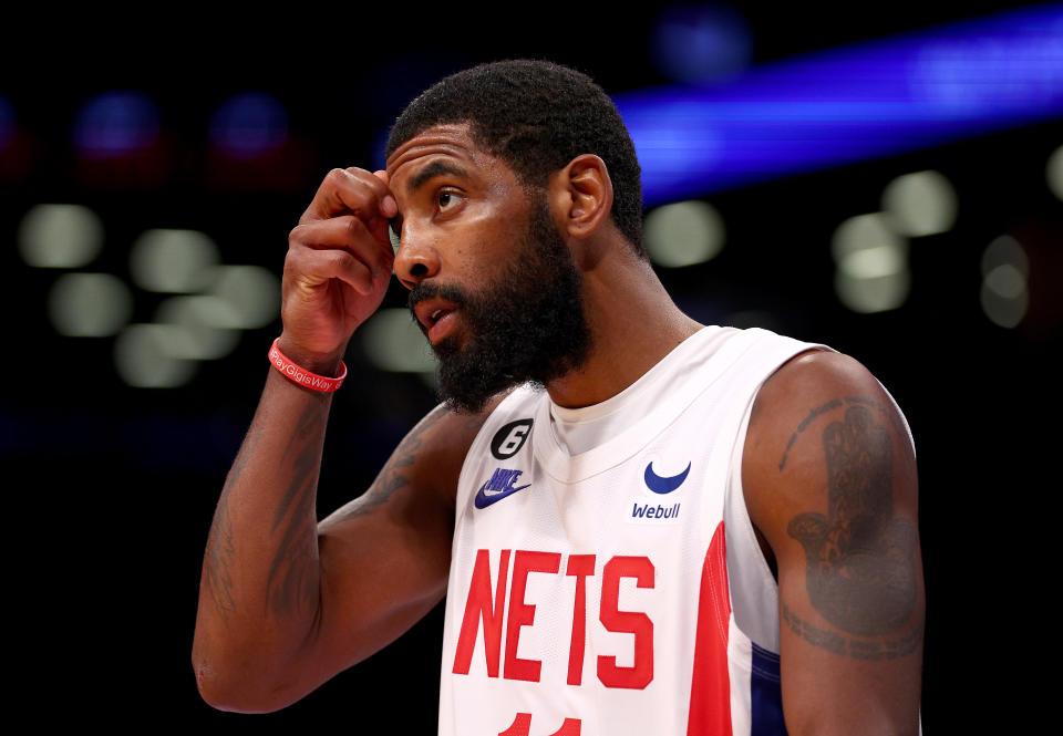 Brooklyn Nets guard Kyrie Irving isn't backing down from the antisemitic views he has posted on social media. (Photo by Elsa/Getty Images)