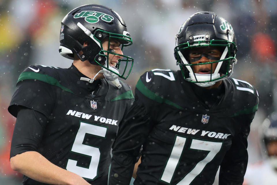 EAST RUTHERFORD, NEW JERSEY - NOVEMBER 27: Mike White #5 of the New York Jets and Garrett Wilson #17 of the New York Jets celebrate after a touchdown in the second half of a game against the Chicago Bears at MetLife Stadium on November 27, 2022 in East Rutherford, New Jersey. (Photo by Mike Stobe/Getty Images)