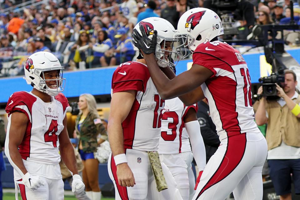 A.J. Green #18 celebrates with Colt McCoy #12 of the Arizona Cardinals after a touchdown in the second quarter of the game against the Los Angeles Rams at SoFi Stadium on November 13, 2022, in Inglewood, California.