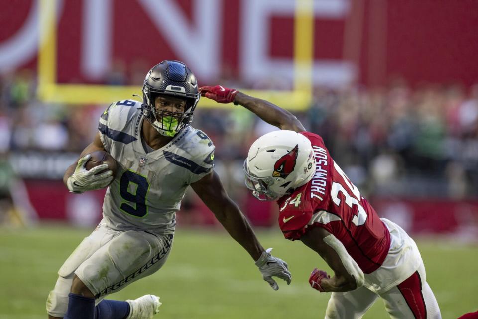 Seattle Seahawks running back Kenneth Walker III runs the ball against the Arizona Cardinals.