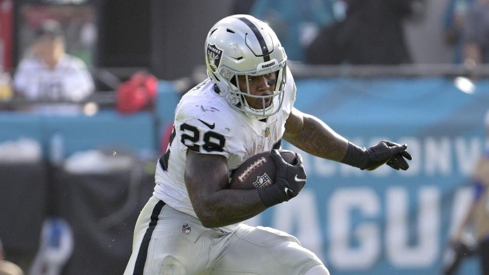 Las Vegas Raiders running back Josh Jacobs rushes for yardage.