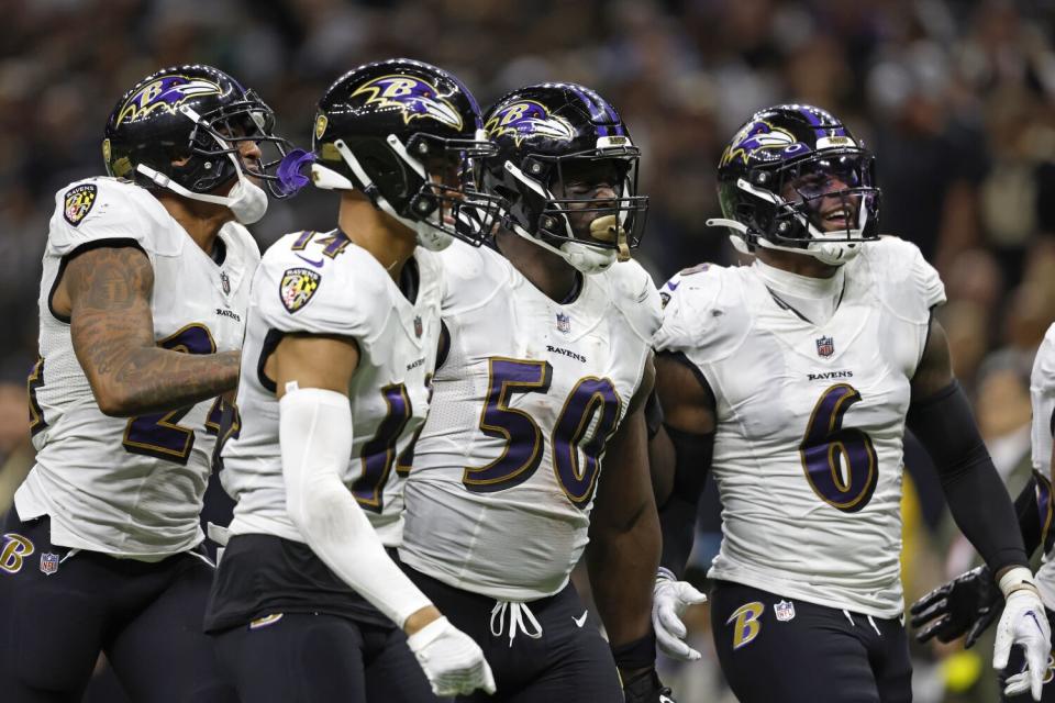 Baltimore Ravens linebacker Justin Houston celebrates after a play against the New Orleans Saints.