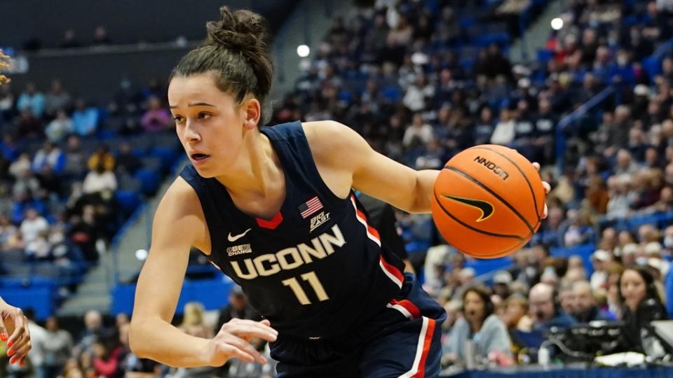 Nov 20, 2022; Hartford, Connecticut, USA; Connecticut Huskies forward Lou Lopez-Senechal (11) dribbles the ball against North Carolina State Wolfpack wing Jakia Brown-Turner (11) during the second half at XL Center. Mandatory Credit: Gregory Fisher-USA TODAY Sports