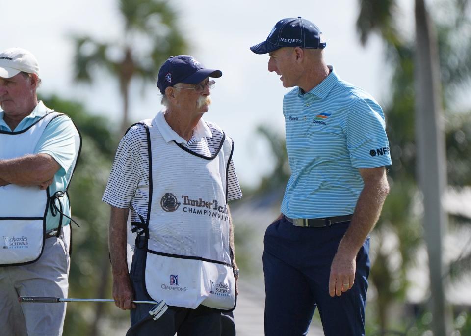 Jim Furyk, right, talks things over with this caddie Michael Thomas “Fluff” Cowan at the 17th hole during the first round of the TimberTech Championship at the Royal Palm Yacht &amp; Country Club in Boca Raton, FL. Friday, Nov. 4, 2022. [JIM RASSOL/palmbeachpost.com]