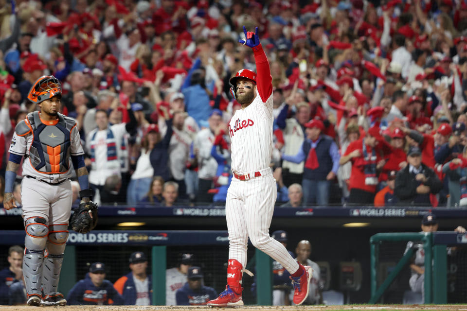 PHILADELPHIA, PA - NOVEMBER 01: Bryce Harper #3 of the Philadelphia Phillies crosses home plate and points to the crowd after hitting a two-run homer in the first inning during Game 3 of the 2022 World Series between the Houston Astros and the Philadelphia Phillies at Citizens Bank Park on Tuesday, November 1, 2022 in Philadelphia, Pennsylvania. (Photo by Mary DeCicco/MLB Photos via Getty Images)