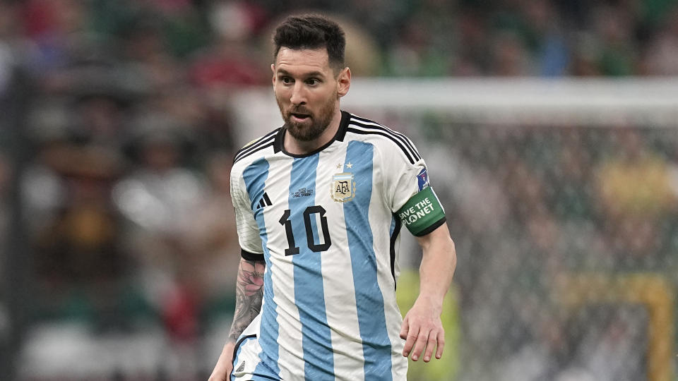 Argentina's Lionel Messi in action during the World Cup group C soccer match between Argentina and Mexico at the Lusail Stadium in Lusail, Qatar, Saturday, Nov. 26, 2022. (AP Photo/Ariel Schalit)