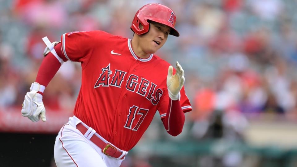 Shohei Ohtani running close-up in red Angels uniform
