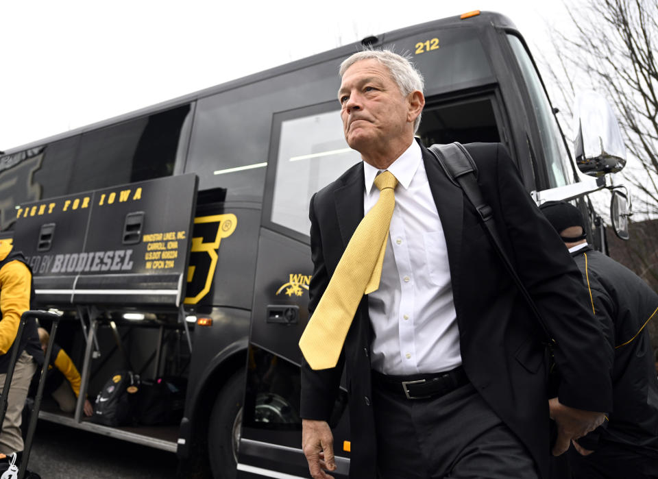 Iowa head Coach Kirk Ferentz exits the bus before an NCAA college football game against Purdue, Saturday, Nov. 5, 2022, in West Lafayette, Ind. (AP Photo/Marc Lebryk)