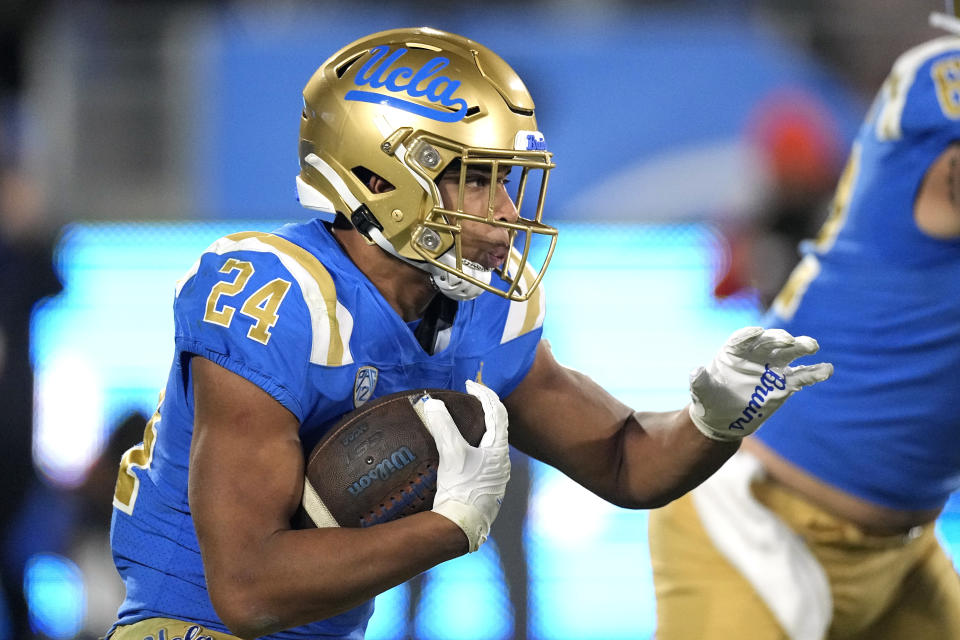 UCLA running back Zach Charbonnet runs the ball during the first half of an NCAA college football game against Arizona Saturday, Nov. 12, 2022, in Pasadena, Calif. (AP Photo/Mark J. Terrill)