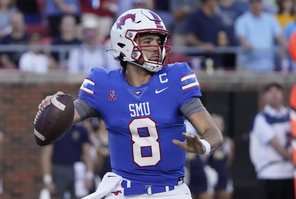 SMU quarterback Tanner Mordecai (8) looks to pass during the first half of an NCAA college football game against Navy in Dallas, Friday, Oct. 14, 2022. (AP Photo/LM Otero)